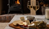 Castle View Cottage - enjoy the warmth of the wood burner alongside delicious nibbles