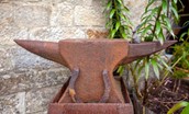 Anvil Cottage - the decorative anvil in the garden
