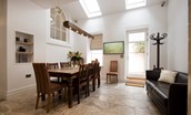 Number One Clayport Street - the double-height dining area with large table and sofa