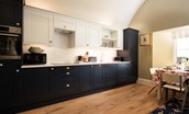 Lakeside Cottage - Alice - the single-wall kitchen is neat and compact, with all of the essentials for a self-catered stay