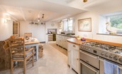 Abbey House - the bright kitchen with breakfast dining space - please note the cooker is now electric with a ceramic hob