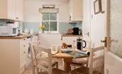 Daffodil Cottage - the kitchen with dining space for four guests