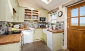 April Cottage - the shaker-style kitchen with coastal views