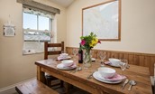 April Cottage - the dining table has bench seating
