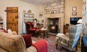 April Cottage - the cosy sitting room with wood burning stove