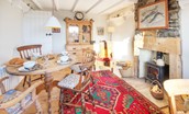 Artist's Cottage - the dining room is full of character and has a wood burning stove