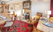 Artist's Cottage - the dining room has an art desk and wood burning stove