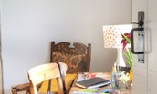 Artist's Cottage - the art desk in the dining room with well-used paint palette