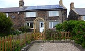 Artist's Cottage - the front garden, private parking space and exterior of the cottage