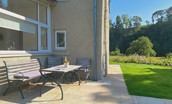 West Mill Cottage - outdoor seating to the side of the property where guests can relax and enjoy the peaceful views
