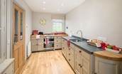 Barley Hill Cottage - the Chalon-style handmade kitchen with door leading to the utility/boot room