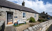 Peep-O-Sea Cottage - enjoy the sea views on the pretty bench with a morning coffee