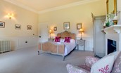 Eslington East Wing - bedroom three with double bed and decorative fire place