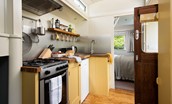 The Showman's Wagon - kitchen complete with cooker, 4 ring gas hob and fridge