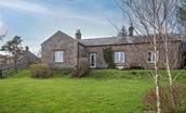The School House - rear aspect of the property which shares a large lawned front garden with the adjoining holiday cottage