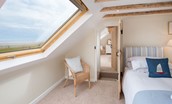 Beachcomber Cottage - bedroom two with twin beds and sea views