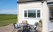 Beachcomber Cottage - sit outside and enjoy the fresh sea air