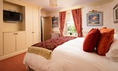 Dryburgh Farmhouse - bedroom five with zip and link beds which can be configured as a super king or twins and wall mounted TV