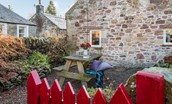 Braemar - outside seating area with red picket gate