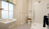 Cambridge House - bedroom four en suite bathroom with walk-in shower, WC and basin