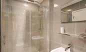 Budle Bay Loft - family bathroom with walk-in shower, WC and basin