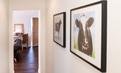 Byre - hallway with farm-themed artworks