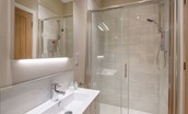 Byre - bedroom one en suite bathroom with WC, basin and walk-in shower