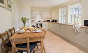 Byreman's Cottage - spacious kitchen with dining table seating six guests