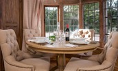 Captain's Rest - the dining table and stylish upholstered chairs are set into the deep bay window