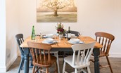 Chestnut Cottage - dining area with wooden table and six farmhouse dining chairs