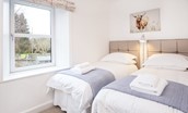 Chestnut Cottage - bedroom two with twin beds and views over the rear garden