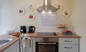 Coachman's Cottage - kitchen area with Nespresso coffee machine, oven and hob