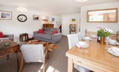 Coldstream Coach House - sitting room with dining area seating for six guests