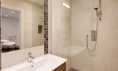 Coledale Stables - bedroom one en suite bathroom with walk-in shower, WC and basin