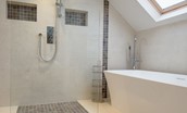 Coledale Stables - bedroom two en suite bathroom with large walk-in shower, free-standing bath, WC and basin