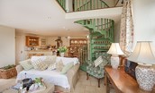 East Cottage - open-plan living area with kitchen and spiral staircase