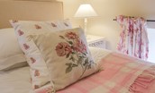 East Cottage - bedroom two with floral and plaid furnishings