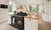 Edenside House - spacious kitchen with Rangemaster, TV, views over the garden and dining space for ten guests