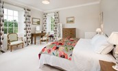 Edenside House - bedroom three on the first floor with zip and link beds, dual aspect views over the garden, dressing table and chest of drawers