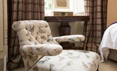 Edenside House - game bird print armchair in bedroom two