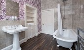 Edenside House - family bathroom with roll top bath and shower over, WC and basin