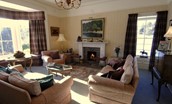 Ellemford Estate - formal drawing room with ample seating, open fire and dual aspect views