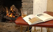 Ellemford Estate - enjoy a book by the open fire on the leather fender