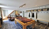 Ellemford Estate - games room with pool table, armchairs and ample hanging and storage space