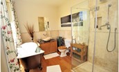 Ellemford Estate - bedroom two en suite bathroom with roll top bath, WC, basin and large walk-in shower