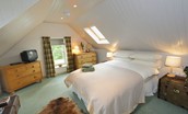 Ellemford Estate - bedroom eight on the first floor of the annexe with king size bed, two chest of drawers and TV