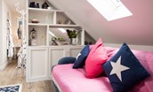 Lydia - the modern navy blue and bright pink colour scheme carries through the apartment