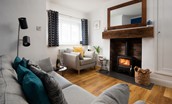 Peewit Cottage - cosy sitting room with, log burner, smart TV and comfy seating for 4 guests