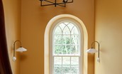 The Old Rectory - enjoy the garden views from the arched window