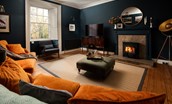 Cairnbank House - relax in front of the cosy wood burner in the sitting room while watching TV